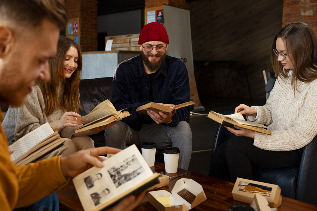 side view people holding books